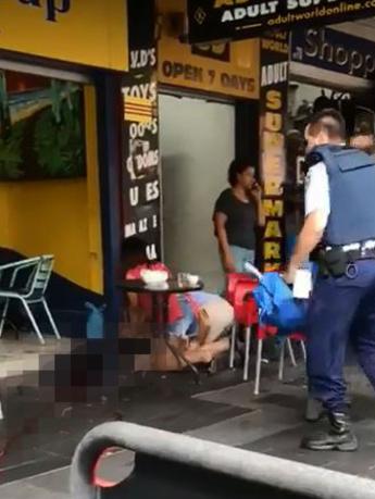 A woman desperately tries to perform CPR on the shot man. Picture: Supplied