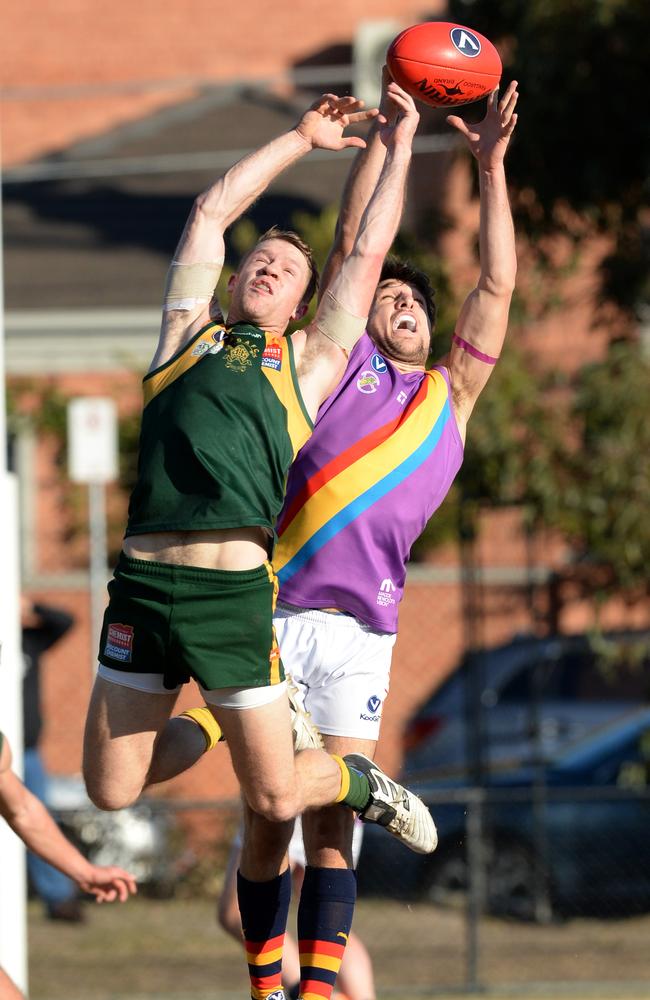 Old Trinity’s Connor Lindsey and St Bedes’ Robert Ludica contest a mark. Picture: Chris Eastman