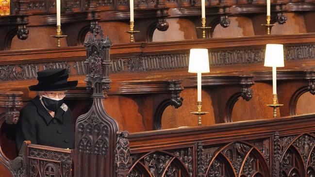 One of the most poignant images of the Queen during her 70 year long reign was of her sitting alone in St George’s chapel during the funeral of her husband Prince Philip. Picture: Getty Images.