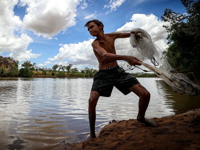 27/02/2020Shanen Gardner (14) from Fitzroy Crossing fishing at  Fitzroy River at Danggu Geikie Gorge, Fitzroy Crossing.Pic Colin Murty The Australian