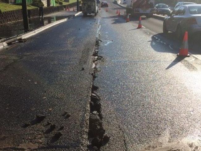 The water has caused significant damage to Lane Cove Road. Picture: Live Traffic