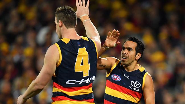 ADELAIDE, AUSTRALIA - JULY 21: Josh Jenkins is congratulated by Eddie Betts of the Crows after kicking a goal during the round 18 AFL match between the Adelaide Crows and the Geelong Cats at Adelaide Oval on July 21, 2017 in Adelaide, Australia. (Photo by Daniel Kalisz/Getty Images)