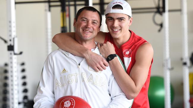 Dmitri Markov with his son Oleg before he was drafted to the AFL in 2015. Picture: Naomi Jellicoe