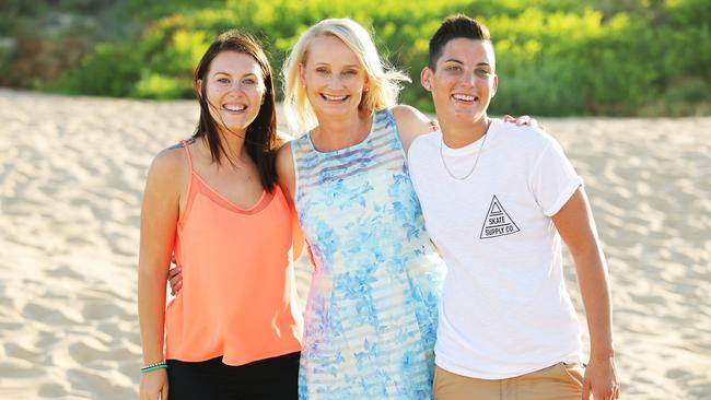 Carly and Christie had a commitment ceremony on the beaches with celebrant Trish Johnson and will get married legally when law changes. Picture: Braden Fastier