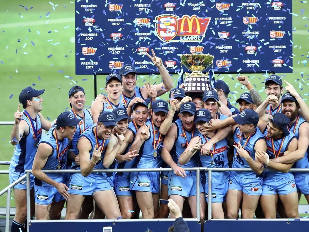 Sturt celebrate their Grand Final win on the podium. Picture Sarah Reed