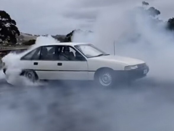 People have posted videos of cars doing burnouts around Hobart to social media. Source: Screenshot from TikTok