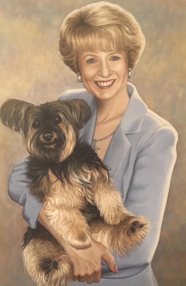 The portrait of Lee Carseldine's mum Beth and a previous family dog, Phoebe, that lines the family’s hallway. Picture: Supplied.