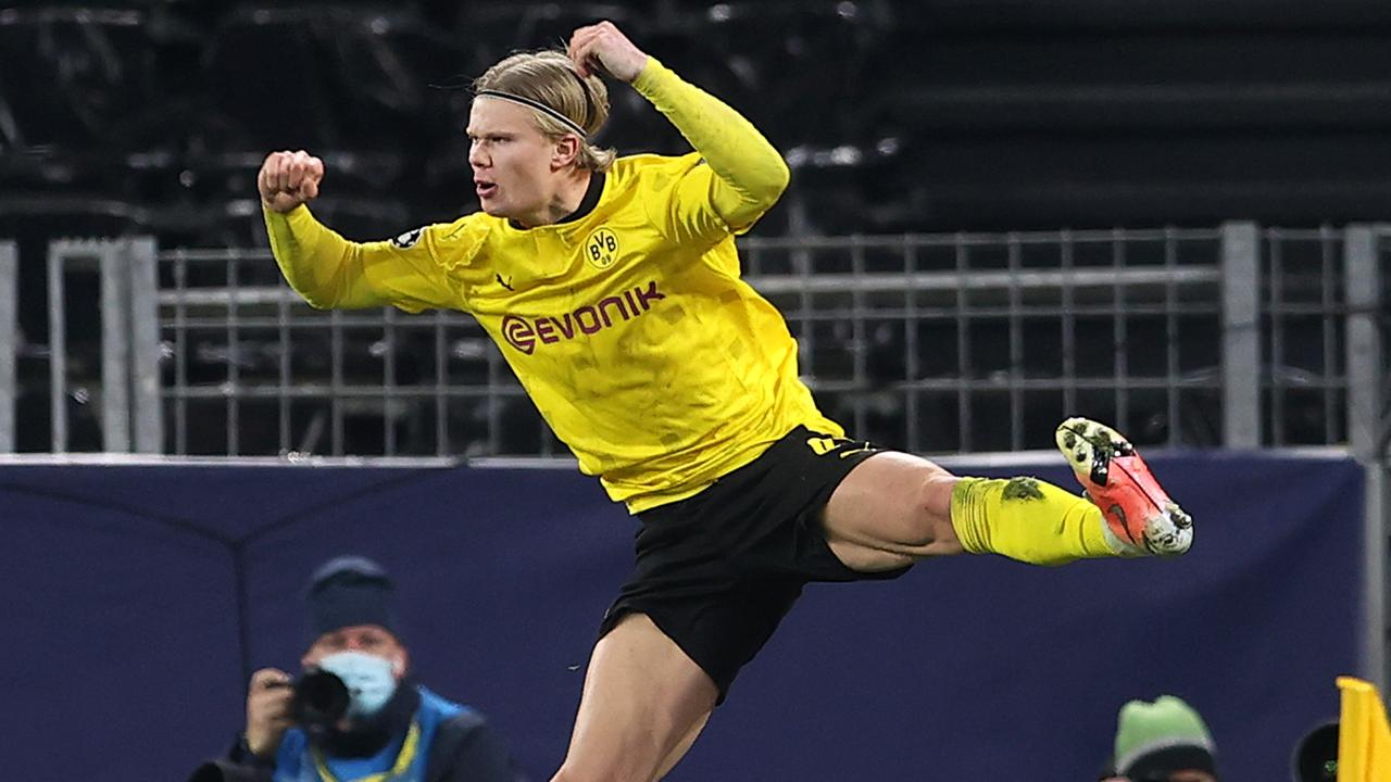 Erling Haaland celebrates after scoring their side's second goal from the penalty spot during the UEFA Champions League Round of 16 match between Borussia Dortmund and Sevilla FC.