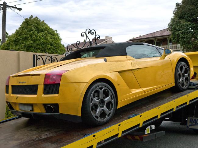 A yellow Lamborghini towed from a property as part of Operation Volante.