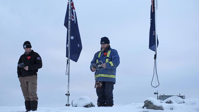 Australian Antarctic expeditioners holding an Anzac Day dawn service in subzero temperatures at Casey research station. Picture; AAP.