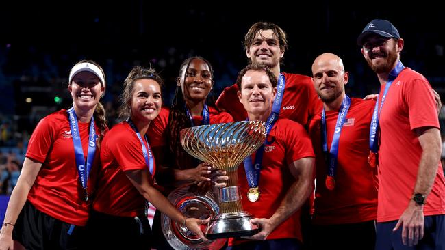 Team United States members Coco Gauff, Taylor Fritz, Denis Kudla, Robert Galloway, Danielle Collins, Desirae Krawczyk and Michael Russell pose with the United Cup Trophy. (Photo by Brendon Thorne/Getty Images)