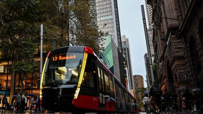 A light rail tram makes its way through George St in the Sydney CBD. Picture: Saeed Khan