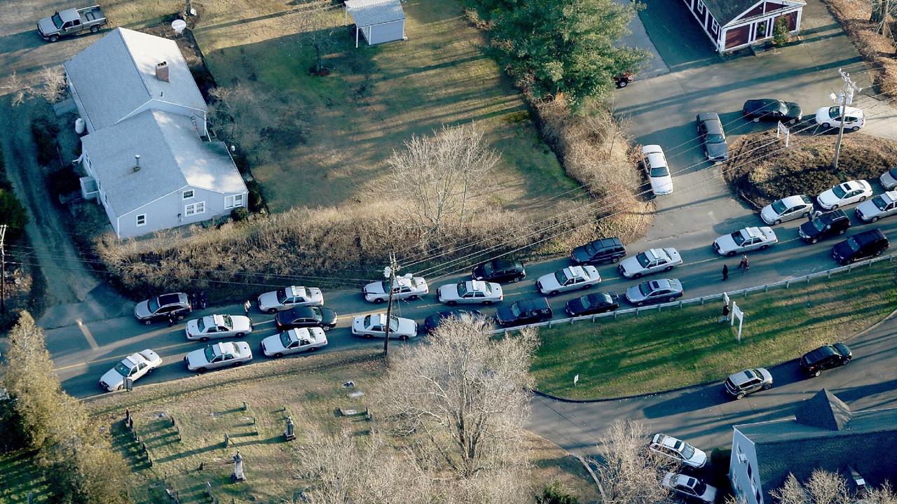 Police cars and other vehicles fill a road near the scene of the mass school. Picture: Mario Tama/Getty Images/AFP