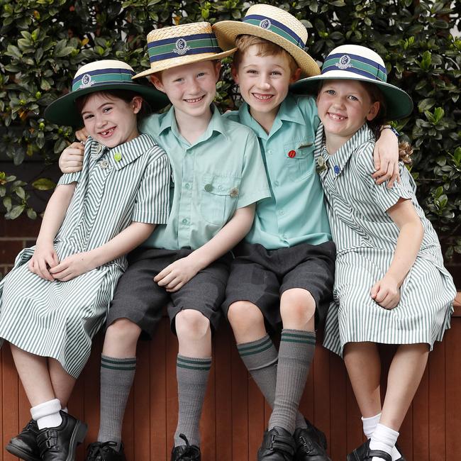 Dylan Aziz, Oliver Blake and Hugo Heinenmann, all 6, with Maggie Wade, 7, at Clayfield College. Picture: Josh Woning