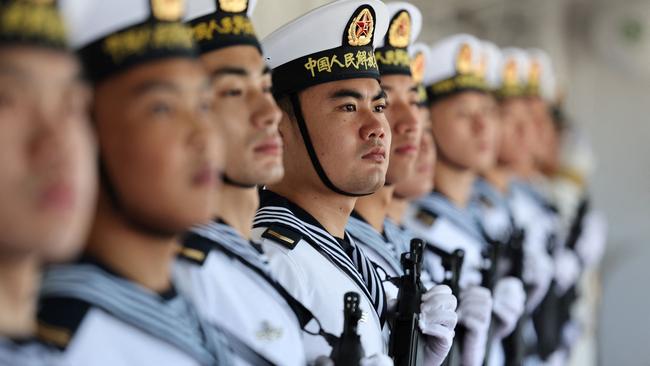 Chinese servicemen in formation on the Chinese naval hospital ship Peace Ark. Picture: AFP