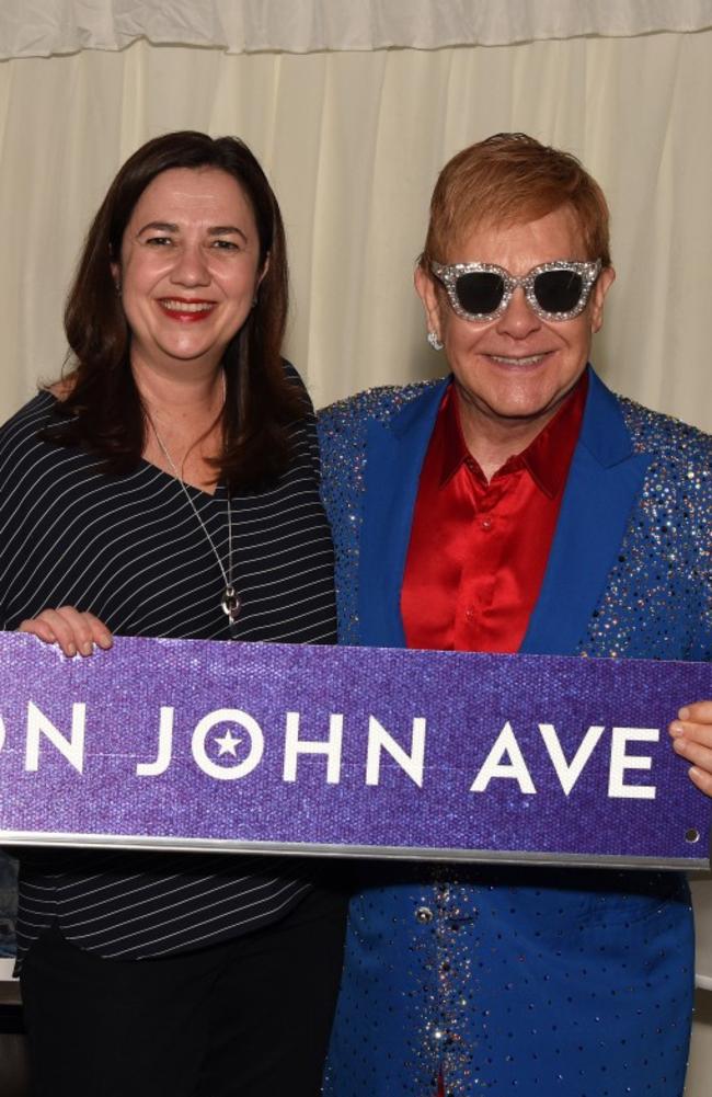 Annastacia Palaszczuk presenting British musician Sir Elton John with a street sign, ahead of his 2017 Australian tour in Mackay. Picture: AAP Image/Pollack Consulting, Ben Dolphin