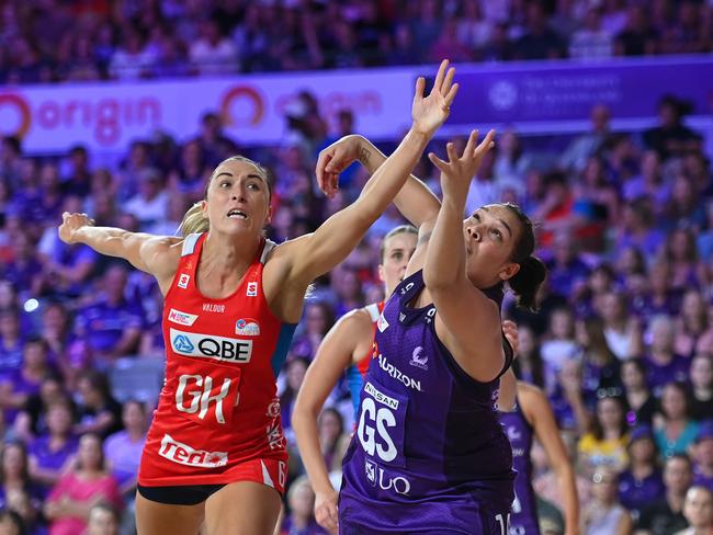 BRISBANE, AUSTRALIA - APRIL 28: Sarah Klau of the Swifts and Donnell Wallam of the Firebirds compete for the ball during the round three Super Netball match between Queensland Firebirds and NSW Swifts at Nissan Arena, on April 28, 2024, in Brisbane, Australia. (Photo by Albert Perez/Getty Images)