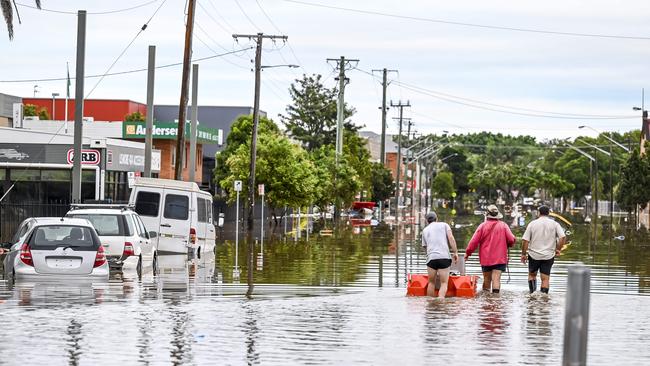 Thursday 31st March 2022 Lismore Suburbs today Local residents taking to the flood waters to see the damage caused. Picture: Darren Leigh Roberts