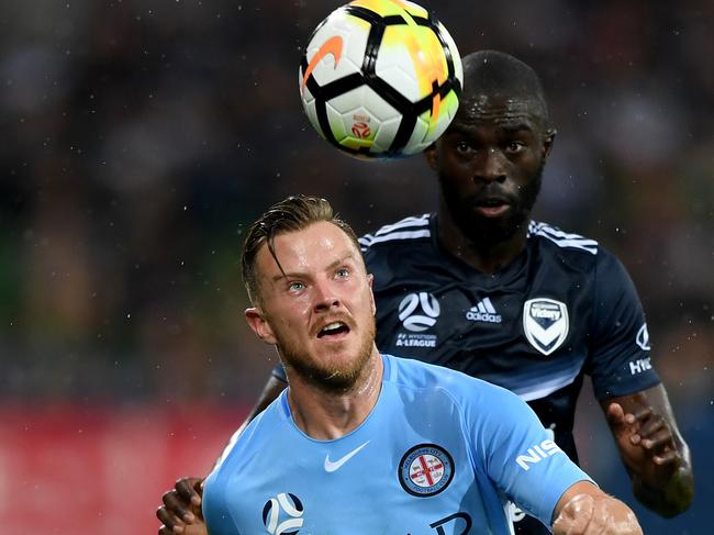 Scott Jamieson of City and Jason Geria of Victory contest for the ball during the round 12 A-League match between Melbourne City and Melbourne Victory at AAMI stadium in Melbourne, Saturday, December 23, 2017.(AAP Image/Joe Castro) NO ARCHIVING, EDITORIAL USE ONLY