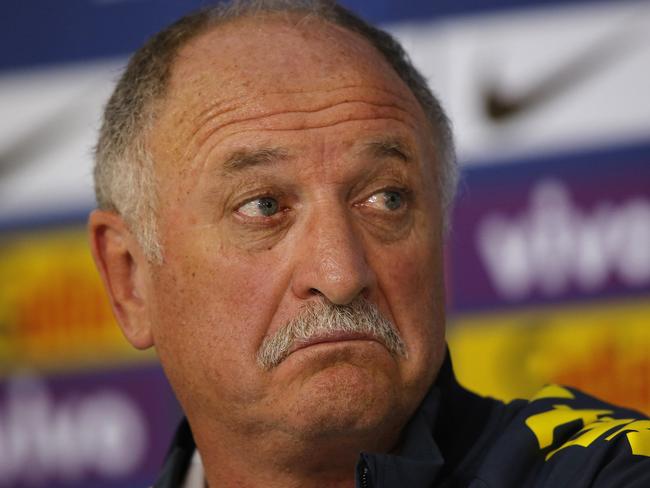 Brazil's coach Luiz Felipe Scolari gestures during a press conference at the Granja Comary training center in Teresopolis, Brazil, Wednesday, July 9, 2014. Brazilians woke up this morning to dreadful headlines describing their soccer team's historic defeat of 7-1 to Germany in the World Cup's semifinal. (AP Photo/Leo Correa)