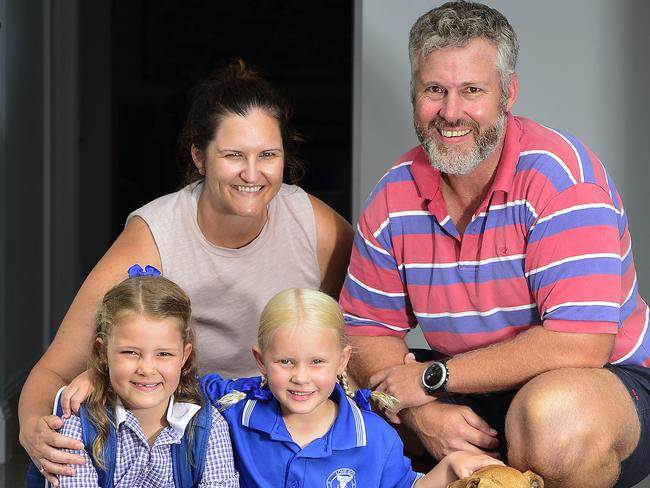 Mia and Lucy McLennan, pictured with mum Chelsea, dad Ross and their dog Leo, will be starting Prep and Year 1 tomorrow. PICTURE: MATT TAYLOR.