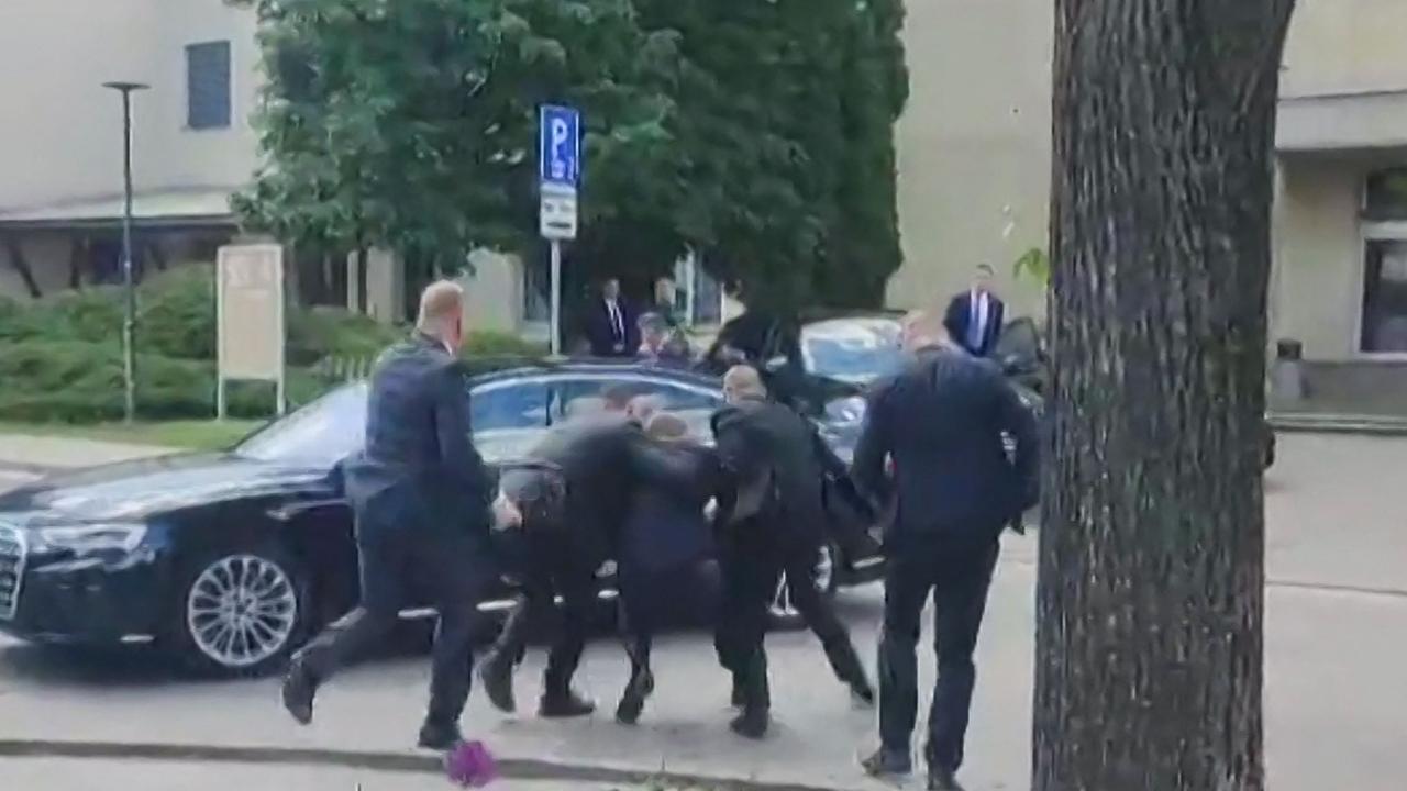 TOPSHOT - This image taken from video footage obtained by AFPTV shows security personnel carrying Slovakia's Prime Minister Robert Fico (C) towards a vehicle after he was shot in Handlova on May 15, 2024. Slovakia's Prime Minister Robert Fico was battling life-threatening wounds after officials said he was shot multiple times in an assassination attempt condemned by European leaders. (Photo by RTVS / AFP)