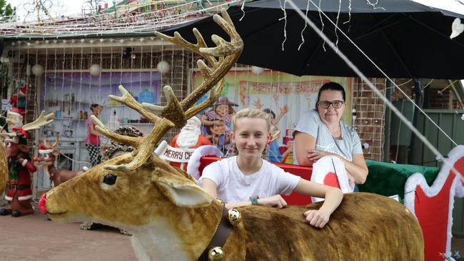 Sharon and Ebony Peach have added a Santa sleigh and life-size reindeer to their Christmas collection. Picture: Craig Wilson