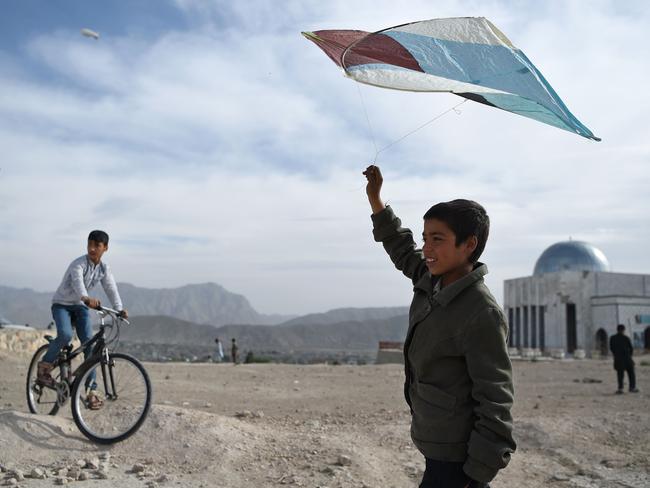 An Afghan boy prepares to fly a kite during a kite battle on a hillside in Kabul in 2018. Picture: AFP