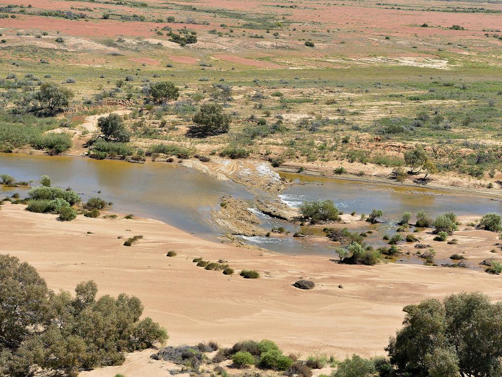 Aerial view of the Neales River in full flow running into Lake Eyre (North). Picture: Bianca De Marchi