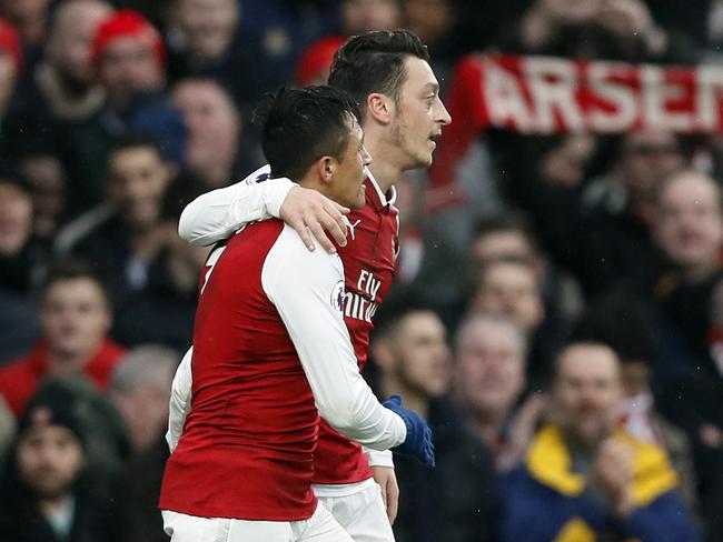 Alexis Sanchez and Mesut Ozil. (AP Photo/Kirsty Wigglesworth)