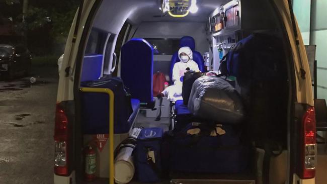 The writer’s six-year-old daughter waits in an ambulance in Jakarta for a transfer to a medevac flight to Australia. Picture: Graham Crouch.