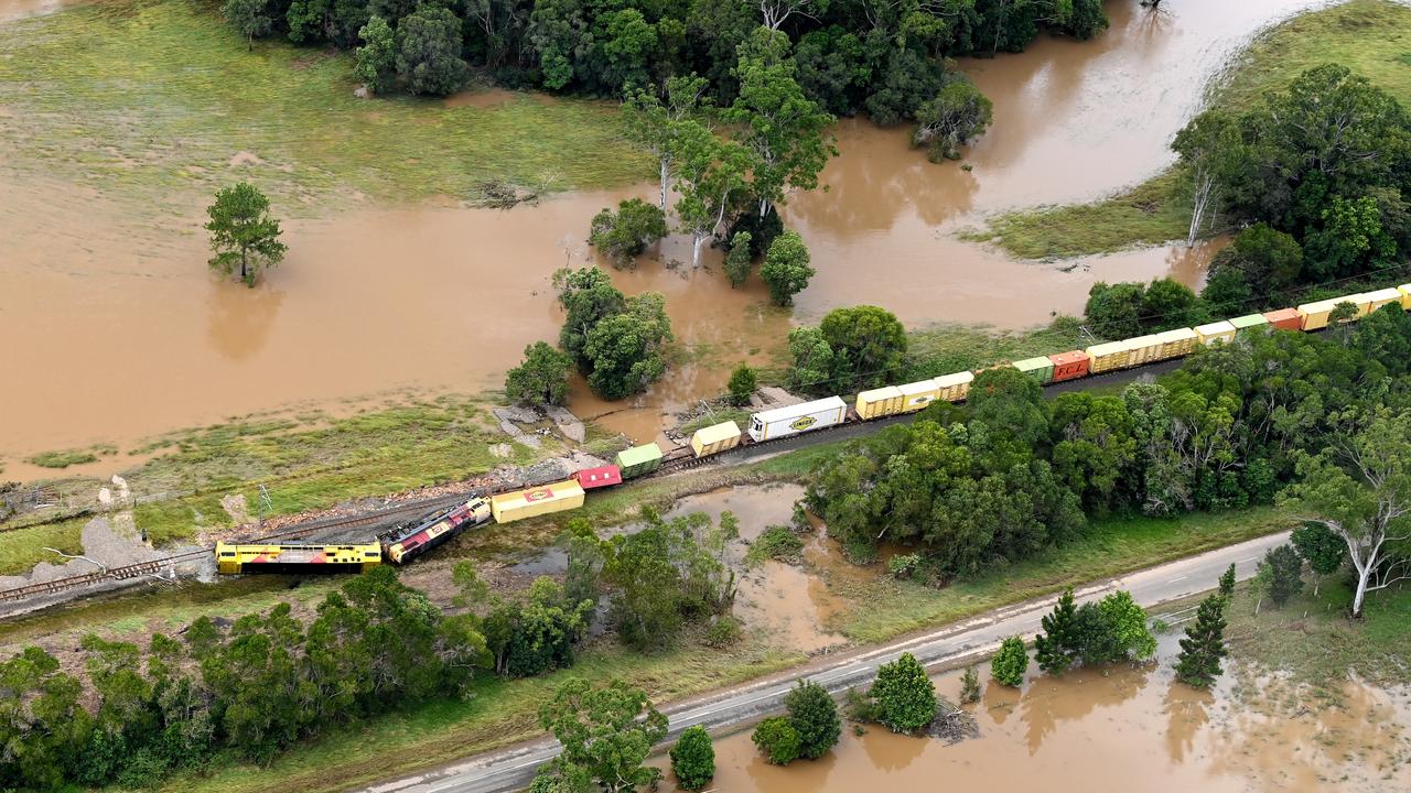 A train is derailed in an accident caused by flooding in the town of Gympie. Photo: Bradley Kanaris/Getty Images