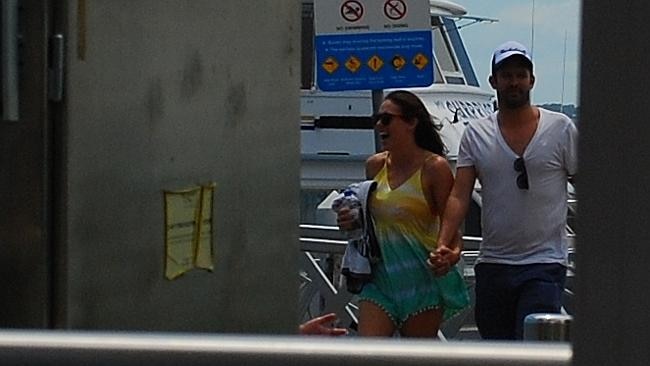 Rochelle and a mystery man hold hands in Nelson Bay yesterday. Picture: Supplied
