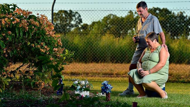 Ray and Pam Palmer share a beer with son Scott at Thorak Cemetery in Darwin. Picture: Michael Franchi