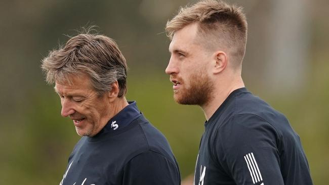 Melbourne Storm coach Craig Bellamy and Cameron Munster talk during a Melbourne Storm training session at Gosch's Paddock in Melbourne, Tuesday, September 10, 2019. (AAP Image/Scott Barbour) NO ARCHIVING