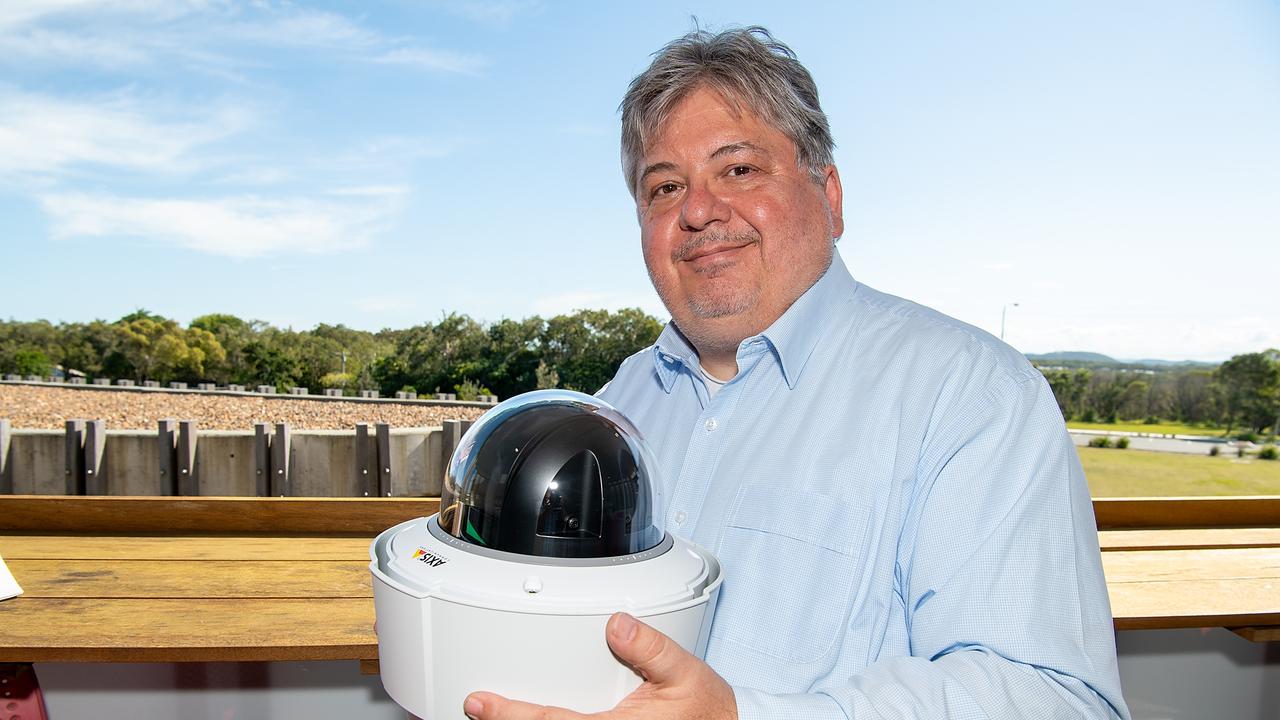 Christopher Tylor of Fireball International with the satellite-linked fire-detecting camera installed at Peregian.