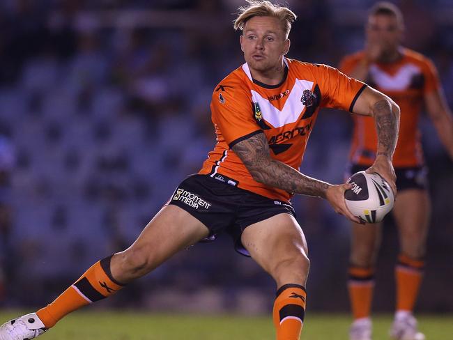 SYDNEY, AUSTRALIA - FEBRUARY 22: Blake Austin of the Tigers passes the ball during the NRL Trial match between the Wests Tigers and the Cronulla Sharks at Remondis Stadium on February 22, 2014 in Sydney, Australia. (Photo by Joosep Martinson/Getty Images)