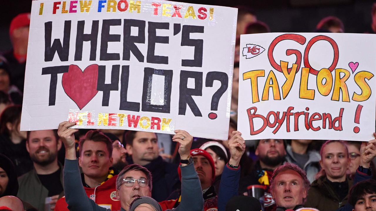 Fans hold up placards referring to Taylor Swift's boyfriend Kansas City Chiefs tight end Travis Kelce during the NFL game between Miami Dolphins and Kansas City Chiefs at the Waldstadion in Frankfurt am Main, western Germany on November 5, 2023. Picture: Kirill KUDRYAVTSEV / AFP