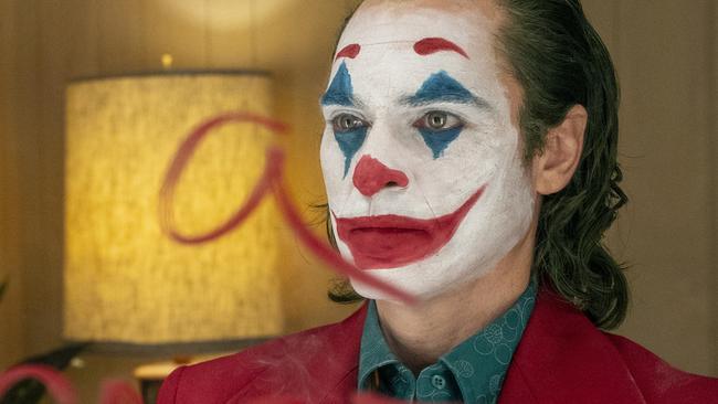 This image released by Warner Bros. Pictures shows Joaquin Phoenix in a scene from "Joker," in theaters on Oct. 4.  (Niko Tavernise/Warner Bros. Pictures via AP)