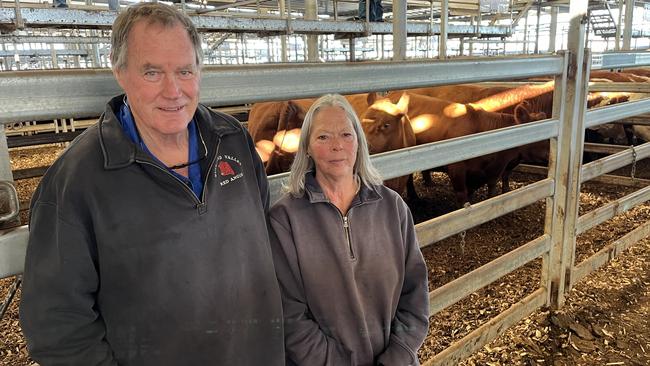 Max Blair and Jan Hall from the Buckland Valley in front of Mr Blair's final pen of commercial Red Angus cows he was ever selling, after moving the operation to run only stud cattle. The PTIC females, which weighed 791kg, sold for $2110.