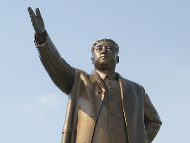 PYONGYANG, NORTH KOREA - OCTOBER 6: North Koreans walk in front of the statue of late North Korean president Kim Il-Sung at the Mansudae Assembly Hall on October 6, 2005 in PyongYang, North Korea. The 60th anniversary of North Korea?s ruling, Korean Workers Party is being commemorated with a cultural and art festival and a nation wide celebration on October 10. The celebrations come amid uncertainties in the breakthrough agreement over North Korea?s nuclear programs.  (Photo by Chung Sung-Jun/Getty Images)