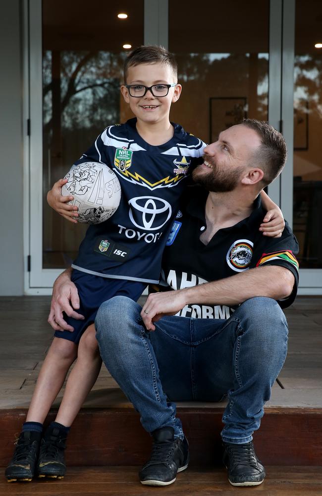 Sebastian Rennie with father Kane. Picture: Toby Zerna