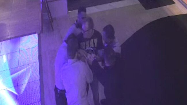 A still from CCTV footage showing a man being grabbed by bouncers at a Cairns casino.