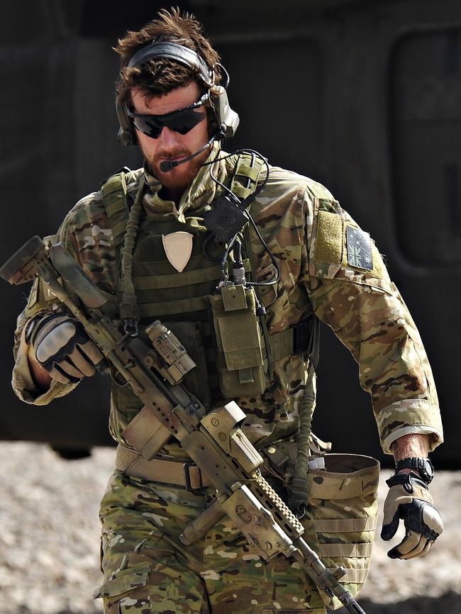 SAS Corporal Ben Roberts-Smith with the Australian Special Operations Task Group leaves a UH-60 Blackhawk helicopter.