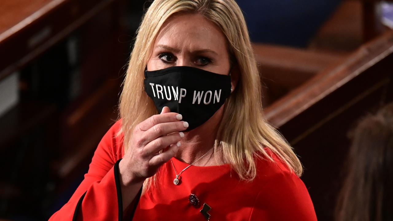 Ms Greene on January 3, wearing a face mask on the floor of the House claiming “Trump won”. Picture: Erin Scott/AFP