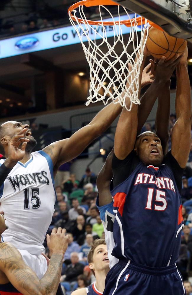 Al Horford makes an offensive rebound against the T-Wolves.