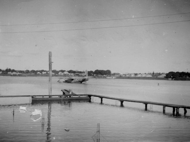 A flying boat at its mooring on the Clarence River, with the original Grafton river pool (safe swimming area) in the foreground.