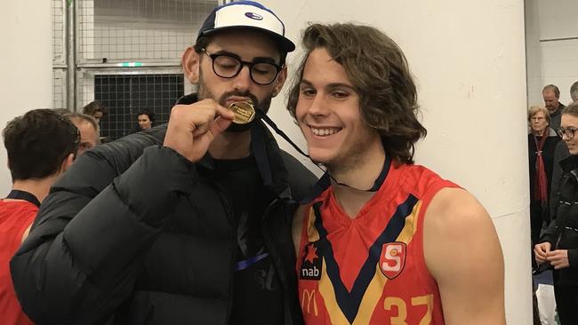 Riley Grundy (right) with brother Brodie after winning the AFL under-18 championships with South Australia this year.