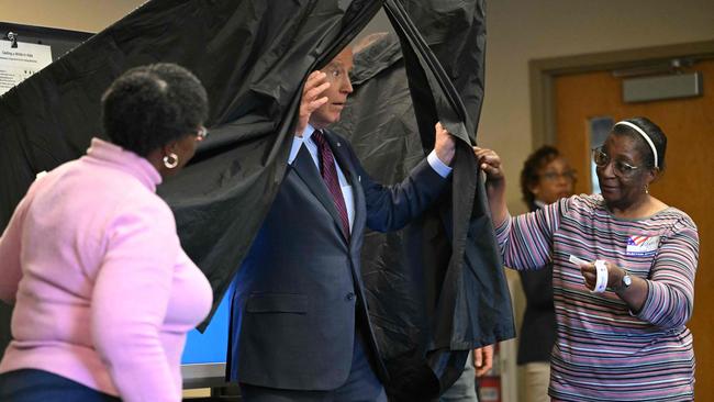 US President Joe Biden steps out of the booth after casting his early-voting ballot in New Castle, Delaware, on October 28, 2024. Picture: AFP