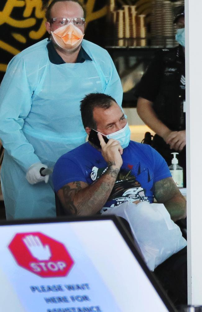 Bikie Shane Bowden is taken from quarantine in the Voco Hotel at Surfers Paradise to Gold Coast University Hospital. Picture Glenn Hampson